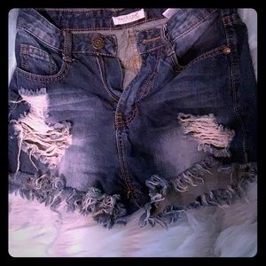 High waisted destroyed cheeky dark jean shorts